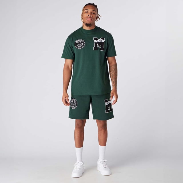 Mens Mercier Academy Shorts in green.- Elasticised waistband.- Open pockets.- Applique logos on leg.- Regular fit.- 65% Cotton  35% Polyester.- Ref: MERC150GREEN