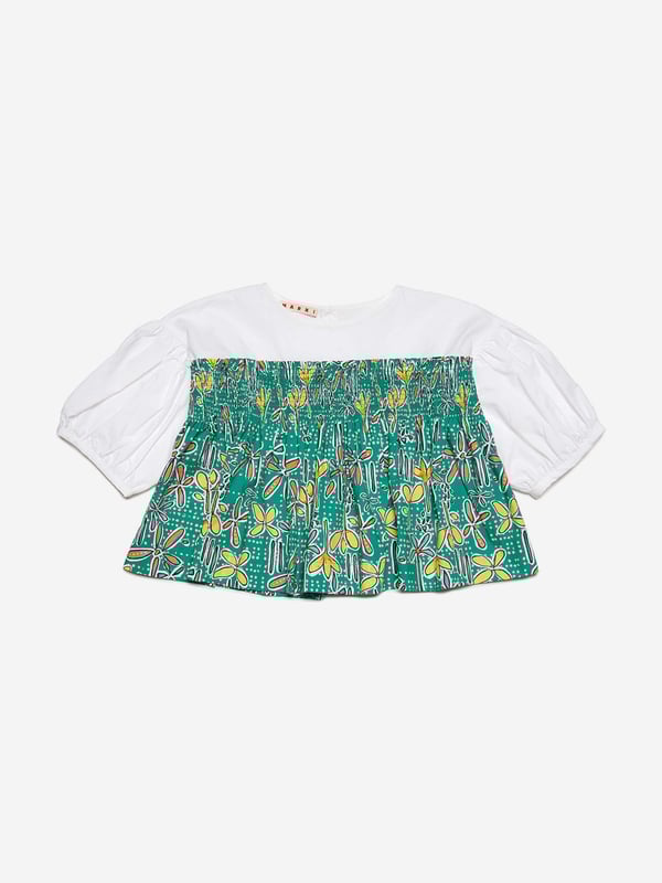 Marni's fresh invigorative perspective is embodied in this girls shirt. Inspired by the early noughties, it showcases poplin balloon sleeves with all-over Carioca graphics and a comfortable elastic. It is the perfect summer garment to be adored.   Button Closure On Back 100% Cotton