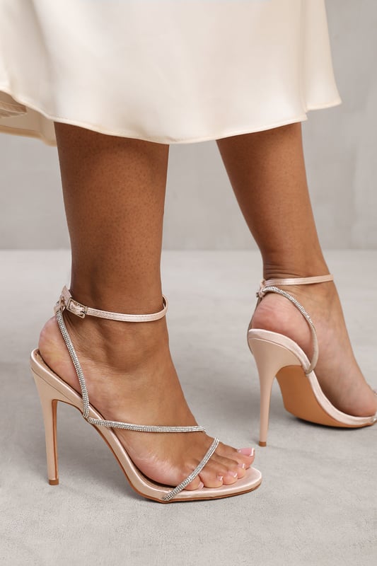 Indulge in glamour and elegance with our Zaneen Stiletto High Heels with Diamante Detailed Strap. These stunning heels are designed to make a statement and add a touch of sparkle to your every step.

Key Features:



Dazzling Diamante Accents: The main strap is adorned with shimmering diamante embellishments that catch the light and add a touch of glamour to these heels.

Stylish Design: The open toe design showcases your pedicure and adds a chic and fashionable element to these high heels.

Ankle Strap for a Secure Fit: The ankle strap provides a secure and adjustable fit, ensuring that the heels stay comfortably in place as you walk or dance the night away.

Comfortable High Heel: The high heel provides an elongated silhouette and adds a touch of sophistication to any outfit, while the cushioned insole ensures all-day comfort.

Durable Construction: Crafted with high-quality materials, these heels are built to last, allowing you to enjoy their elegance for years to come.


Specifications:


Heel Height: 4.5' (11.4cm) approx
Sole: Rubber sole for comfort and traction

Elevate your style and add a touch of bling with our Zaneen Stiletto High Heels with Diamante Detailed Strap. Whether you're attending a wedding, party, or a special occasion, these heels will make you shine with every step. Experience both comfort and glamour, and make a lasting impression with our beautiful high heels.