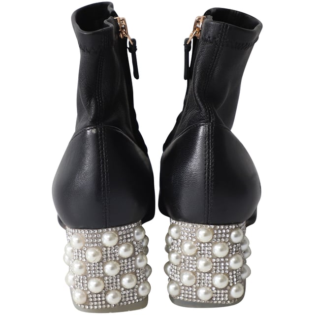 VINTAGE, RRP AS NEW
Sophia Webster lends a statement look to a classic pair of ankle boots with this pair. These ones are crafted using black leather, lined with leather, and styled with heavy embellishments on the block heels. The boots are incredibly stylish.

Sophia Webster Embellished Heel ankle Boots in Black Leather
Material: Leather
Color: Black
Size: EU35/US5/UK2
Condition: very good
Sign of wear: moderate wear on soles, light creases on vamps, few white marks on right shoe
SKU: 153065