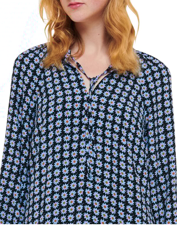 Embrace elegance with the Dot Flippy Dress, perfect for any occasion with its charming floral dot pattern and flippy hem.