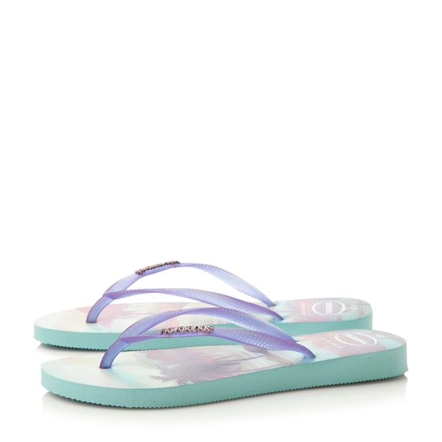 Live out your Rio summer dreams in this scenic jelly flip flop. With airbrush effect sole design and jelly straps with metallic branding. Made in Brazil with non-slip finish, heat and water resistant.