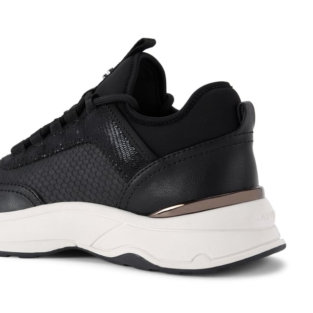 This Swift Runner trainer features a black snake embossed upper with lace up front. There is a gunmetal Icon C stud on the tongue tab and a matching gunmetal panel at the heel.