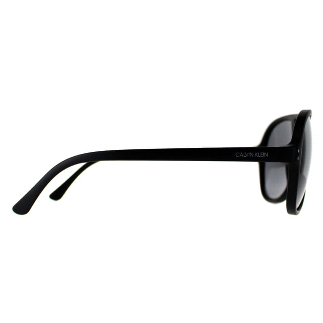 Calvin Klein Aviator Mens Matte Black  Grey CK19532S  Sunglasses are a sleek and versatile shades, boasting a timeless design that effortlessly complements any look. Crafted with precision, the lightweight frame provides comfort while exuding durability, making them perfect for everyday wear. The lenses not only offer superior UV protection but also add a touch of allure. Embrace a blend of fashion and functionality with these sunglasses, a must have accessory for those seeking elegance with an edge.