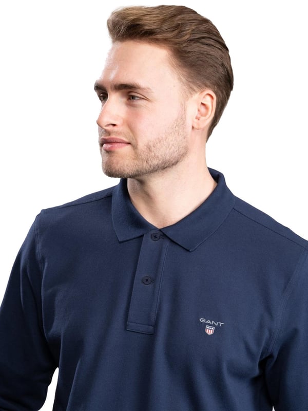 Gant Mens Designer Long Sleeve Polos feature the brands Logo, a Button-Down Collared Neckline. Crafted With 100% Cotton, these Lightweight and breathable Regular Fit Polos are Suitable for Casual or Workwear.