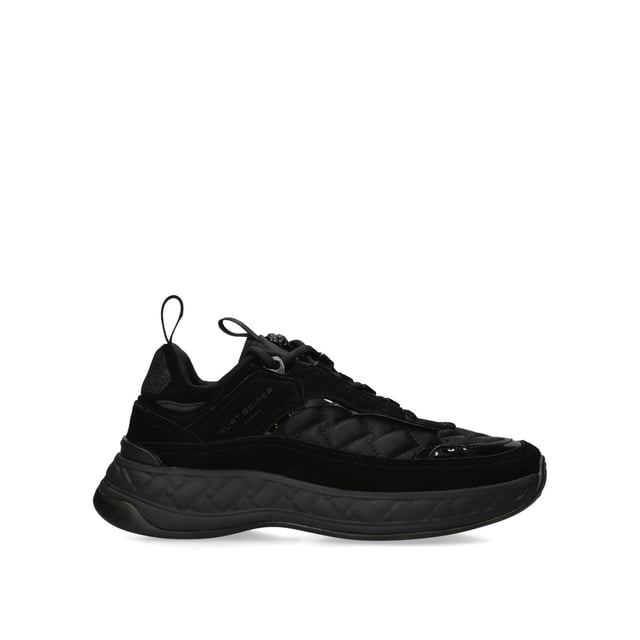 The Kurt Geiger Kensington Sneaker features a black upper in suede, satin and rubber. The tongue features a black branded monocle with black eagle head. Sole height: 4cm.