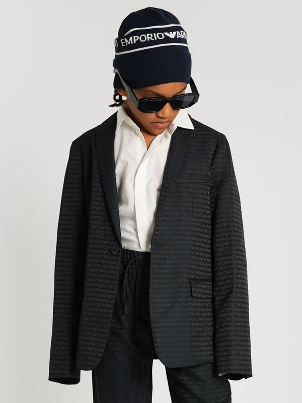 Emporio Armani Boys Branded Blazer in Navy Introducing the Emporio Armani Boys Branded Blazer in Navy for AW2024‚exquisite craftsmanship tailored for the young gentleman. This blazer is a pinnacle of style and elegance for any boy's wardrobe. **Luxurious Comfort:** Crafted with premium fabrics for unparalleled comfort durability. **Sophisticated Navy Blue:** A perfect shade that complements any occasion, ensuring your child looks sharp. **Classic Design:** Features a timeless cut with contemporary Armani styling, ideal for events or casual outings. Elevate your boy's style quotient with this prestigious blazer!