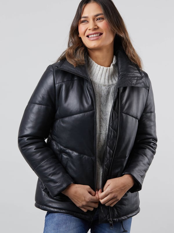 Parton Leather Padded Jacket in Black The contemporary Parton leather padded jacket will keep you warm during the colder months. As well as its cosy puffer style, the Parton features a number of insulating elements, including a high neck, drawstring waist, elasticated cuffs and inner placket.Crafted from soft black aniline leather and cut to a slightly longer length, this jacket is a relaxed fit for a comfortable wear and so you can easily fit your favourite knitwear underneath.SizingThese measurements are based on a size 12 and will vary slightly between sizes.Approximate centre back length (from top of neckline): 68cmApproximate sleeve length from shoulder to cuff: 63cm Approximate sleeve length from underarm to cuff: 43.5cmThe DetailsStyle Name: Parton Leather Padded JacketColour: BlackMaterial: Aniline LeatherFit: Easy fitPadded designHigh-cut neckCentre zip fastening with inner placketTwo front slip pocketsElasticated cuffsDrawstring waistAnd on the insideFabric lining