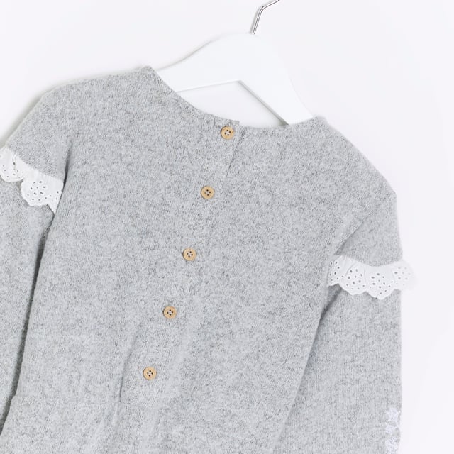 Broderie trim, Embroidered arm detail, Tie waist detail, Button back, Long sleeve, Cuffed hem