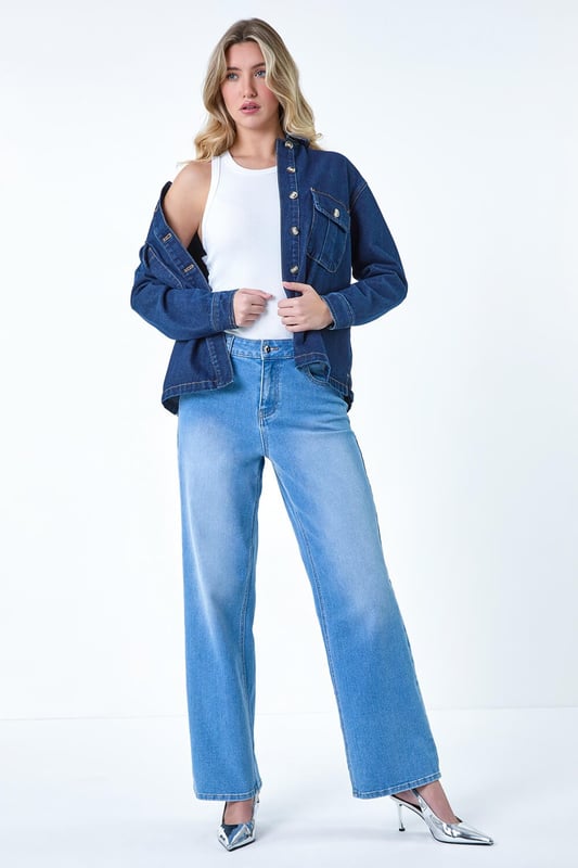 Relaxed Denim Jacket from Roman. Step out in style this Summer with this relaxed denim jacket, featuring a classic button-through front, charming button cuff details, and horn buttons adding a touch of elegance. Complete with a sleek collar, this piece is the epitome of casual sophistication. Pair it effortlessly with your favourite summer ensemble for a versatile and chic look that exudes laid-back charm all season long.