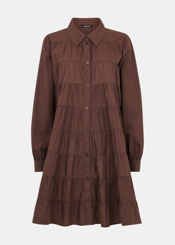 Embrace whimsical charm with the Edie Tiered Dress. Perfect for a laid-back yet stylish look.