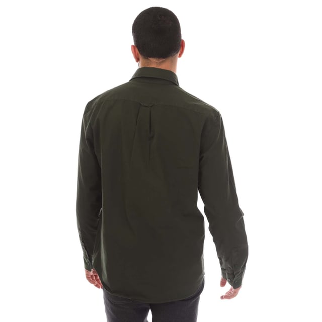 Mens Belstaff Garment Dye Cotton Scale Shirt in green.- Point collar.- Centre front button fastening.- Signature tilted flap pocket.- Adjustable buttoned cuff.- Belstaff Phoenix patch on sleeve.- Garment-dyed cotton twill.- 100% Cotton.- Ref: 104537TLGRN
