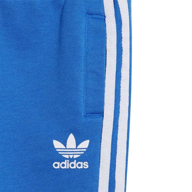 Dress them up in iconic sporty style. A big contrast Trefoil logo and 3-Stripes give this infants' outfit an authentic look. Both pieces are made of a cosy  soft French terry. Hidden shoulder snaps on the sweatshirt make it easy to slip on and off.Ribbed crewneckLong sleeves with ribbed cuffs; Ribbed pants cuffsRegular fit is not tight and not loose  the perfect in-between fit70% cotton  30% polyester (recycled)
