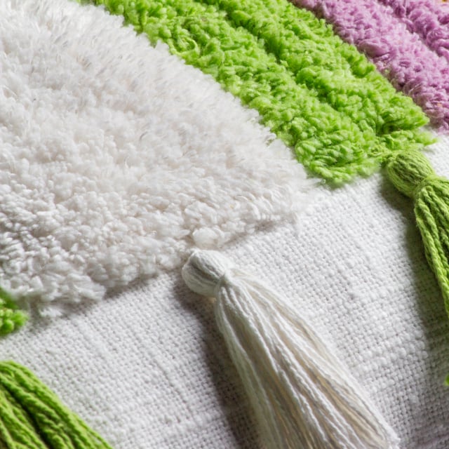 Bring extra fun and happiness to your room with the Rainbow Tassel cushion. In vibrant colours the cotton tufts creates an amazing textured rainbow shape in four different colours, which are backed onto a cotton base. Finished with a multi-coloured tasselled trim to add some extra cool. A fab way to help stamp your personality in your chill space and perfect for throwing on a chair or sofa for a funky laid back style.
