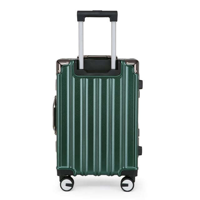 Discover the perfect blend of elegance, durability, and convenience with our Strong Hardshell Cabin Suitcase. Designed with a stunning emerald green finish, this cabin suitcase is crafted for the modern traveler, offering strength and sophistication for all your journeys.

Features:
Premium Polycarbonate Shell: Lightweight yet tough, delivering exceptional protection against wear and tear.
Reinforced Aluminum Frame: Adds durability and structural integrity, ensuring long-lasting performance.
Dual Integrated Locks: Secure your belongings with two built-in combination locks for added peace of mind.
8 Smooth Dual Wheels: Provides effortless 360° maneuverability, making navigation through airports and busy streets a breeze.
Ergonomic Telescopic Handle: Designed for comfortable handling and ease of use.
Stylish Interior: Fully lined with elasticated straps, zippered compartments, and mesh dividers for organized packing.
Size and Specification:
Cabin:
Dimensions: 36 x 24 x 56 cm
Weight: 2.70 kg
Capacity: 42L

Travel smarter and make a statement with this robust suitcase set.