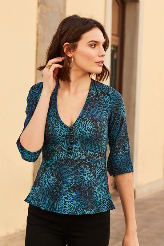 REASONS TO BUY


Because you always have room in your wardrobe for animal print
Peplum waist creates the perfect silhouette
Plunging V-neck, perfect for all bust sizes
Button detail for a luxe look
Effortlessly chic
Pair with black jeans or cropped trousers to nail the ‘jeans and a nice top’ dress code