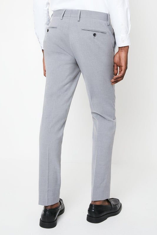 Introducing our Essential Skinny Fit Smart trousers, a must-have addition to your wardrobe. These trousers features a zip fly fastening for convenience and are designed to provide a sleek and polished look. Made with a polyester viscose blend with added stretch to ensure a cool and comfortable fit all day long. Pair these versatile trousers with matching items, perfect for any smart occasion.