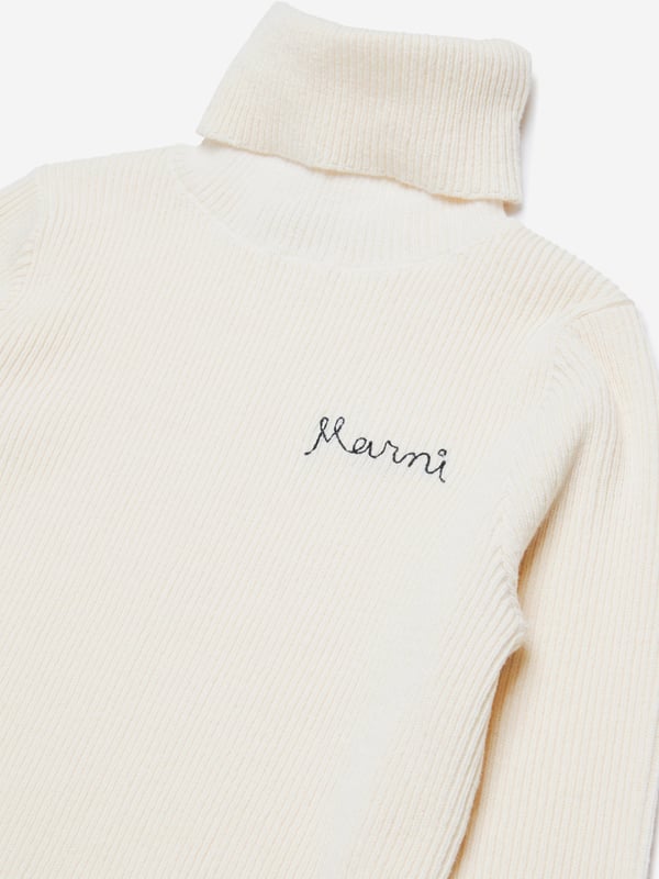 Discover the epitome of elegance with the Marni Girls Knitted Roll Neck Jumper in Ivory, meticulously crafted for AW2024. Tailored to enhance any girl's wardrobe with its sophisticated charm and quality: Luxurious Knit: Expertly woven with premium fabrics for a soft, sumptuous feel. Elegant Ivory: A classic, versatile shade that complements any outfit. Timeless Roll Neck: Offers warmth and style, perfect for cooler days.Elevate her style with this exquisite Marni creation. Order now and wrap your young one in luxury!