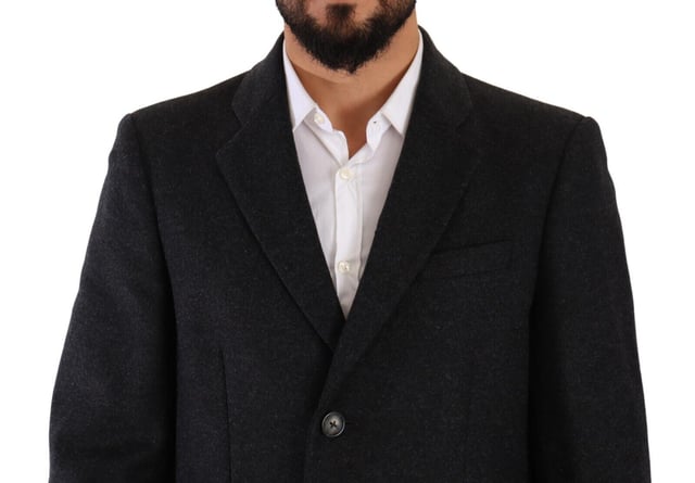 100% Authentic Dolce & Gabbana Single-breasted virgin wool coat
  Made from a blend of 80% Virgin Wool and 20% Nylon
  Dark grey color for a sophisticated look
  Three-button closure
  Logo details
  Made in Italy
  Lined with 50% Viscose and 50% Acetate fabric blend
  Quality craftsmanship