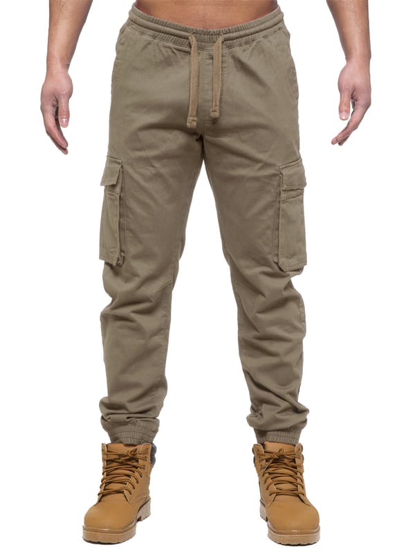 Enzo Mens Elasticated Waist Stretch Cuffed Jeans. Features a 5 Pocket Design. 2 Slash Pockets, 1 Back Pocket 2 Front Cargo, Bellow Side Pockets With Velcro Fastening. Elasticated Waist With Adjustable Drawstings. Cut and Sew Design On Leg. Cuffed Ankle
