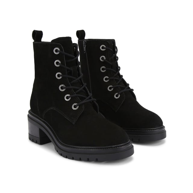 This KG Kurt Geiger Crystal Lace Up Boot features a black suede upper with crystal eyelets at the front. There is a small gunmetal KGL stud at the back of the ankle.