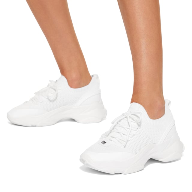 This KG Kurt Geiger Lively sneaker features a white knitted upper with lace up front. There is silver branding across the upper and the sole is extra chunky.