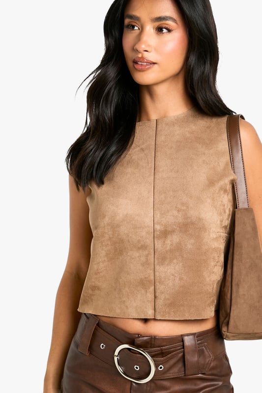 Petite Faux Suede Racer Top Gain some serious style points this season in our petite tops. Cut shorter to ensure the perfect fit, our tops for petite women are designed for queens 5'3'' and below. From petite t-shirts to women's petite blouses, we've got all the new-season styles you need in your wardrobe. Feeling casual? Dress it down with your fave pair of denim jeans and a leather. If out out is more your vibe, team with some leather trousers and high heels to make a statement!Style: TopFabric: Faux Suede