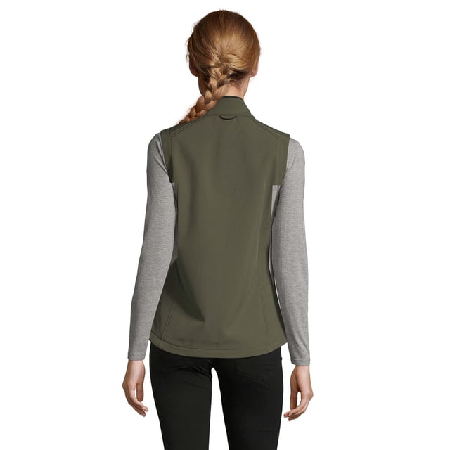 Stretch soft shell fabric has a polyester/elastane outer, membrane and a polyester fleece backing. Mesh lined front body panels. Breathable, windproof and water resistant. Shaped fit. Taped neck. Collar high full zip with inner storm flap and chin guard. Two front zip pockets and one right chest zip pocket. Adjustable drawcord at hem. Drop tail. Access for decoration. Material: 94% polyester/6% elastane. Ladies size: S(8/10), M(12), L(14), XL(16), XXL(18).