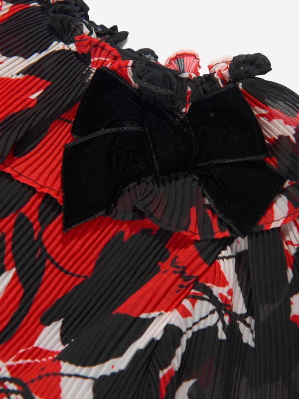 Introducing the Girls Chiffon Floral Dress in Black by Patachou, a sophisticated addition to your little one's attire collection. Elegantly comfortable wear for any occasion. Discover why it's the must-have dress: Timeless Floral Design: The trendy black chiffon with delightful floral prints adds elegance and makes it a wardrobe staple.  Plush Comfort: Crafted with superior quality fabrics, assures your girl's comfort throughout the day. Upscale your Girls wardrobe with this Patachou's designer dress in black. Let her make a statement with her style!