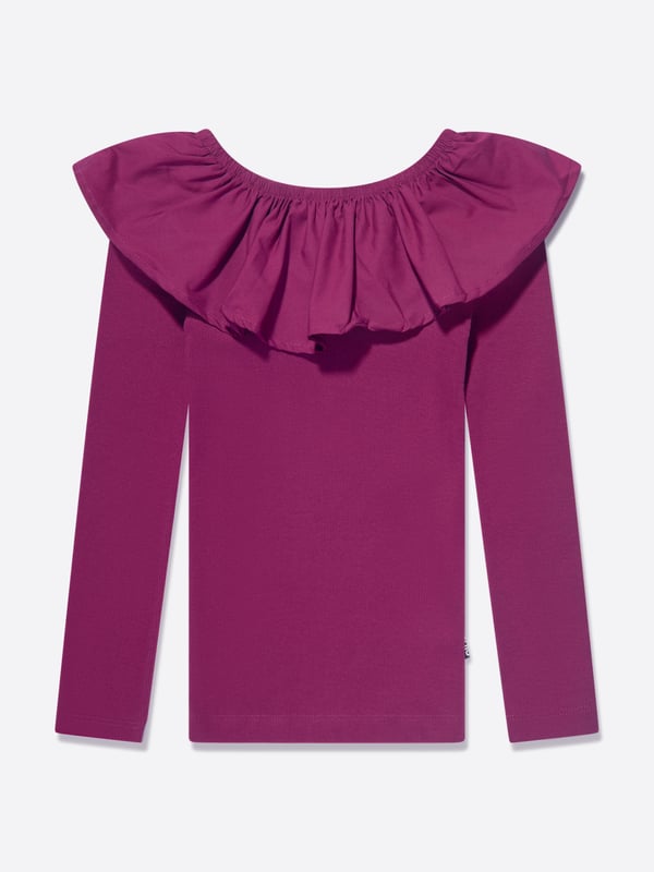 Introducing the Molo Girls Long Sleeve T-Shirt in Purple, an essential luxury item for your little girl's wardrobe. Here the reasons why this top is a perfect addition: Unique Style: A captivating purple hue that effortlessly evokes elegance and charm, seamlessly blending comfort with style. High-End Design: Created by Molo, this high-end brand guarantees credibility and quality, promising a garment that's designed to stand out. Exceptional Comfort: Crafted from premium, snugly materials, ensuring your girl's ultimate comfort for all day wear.  Dress it up or down: Versatile and stylish, it can be accessorized for a fancy outing or worn for a casual day. Add the Molo Girls Long Sleeve T-Shirt in Purple to revamp her wardrobe now!