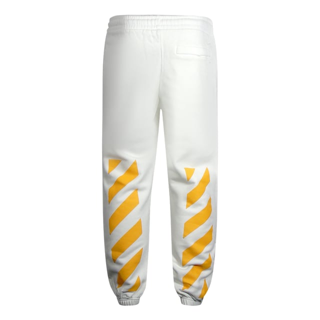 Pantalones deportivos color blanco roto, pintura de Caravaggio blanquecino en la pierna izquierda, cintura y puños elásticos, diseño de diagnóstico amarillo. 100% Algodón, Hecho En Portugal, Joggers Blancos