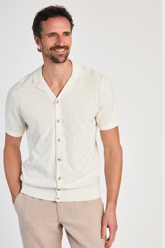 This knitted shirt from Kensington Eastside is a perfect mix of style and comfort. With a subtle checked pattern on the front and a laid-back Cuban collar, it’s an easy go-to for smart-casual outfits. Lightweight and breathable, it’s great for any occasion where you want to look sharp with minimal effort.