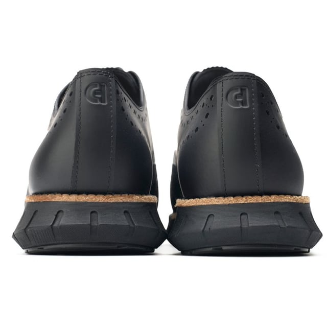 Mens black Cole Haan zerogrand remastered shoes, manufactured with leather and a rubber sole. Featuring: flowerfoam sole, brogue detail, cole haan branding and dandelion rubber.