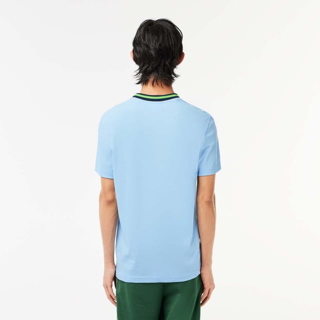 Men's Lacoste Stripe Collar Stretch Piqué T-Shirt.- Regular fit, natural ease on body.- Stretch mini pique, made of organic cotton and elastane.- Striped ribbed collar with contrasted tipping detail.- Tone on tone crocodile at chest. Material: 94% Cotton, 6% Elastane. Ref: TH1131HBP.