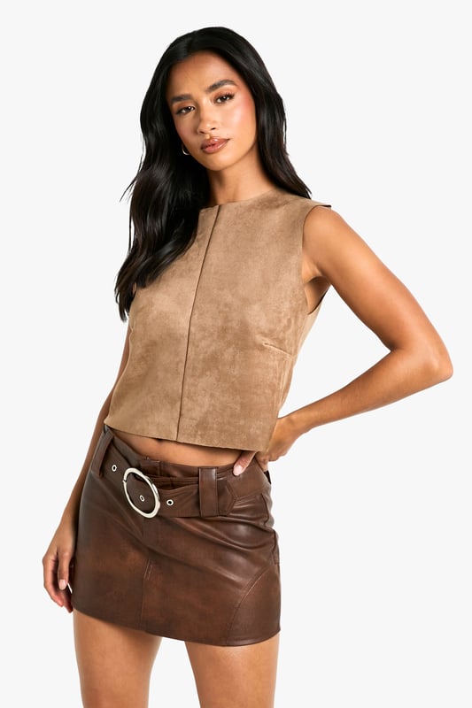 Petite Faux Suede Racer Top Gain some serious style points this season in our petite tops. Cut shorter to ensure the perfect fit, our tops for petite women are designed for queens 5'3'' and below. From petite t-shirts to women's petite blouses, we've got all the new-season styles you need in your wardrobe. Feeling casual? Dress it down with your fave pair of denim jeans and a leather. If out out is more your vibe, team with some leather trousers and high heels to make a statement!Style: TopFabric: Faux Suede