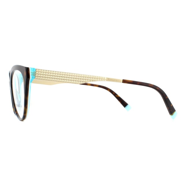 Tiffany Glasses Frames TF2180 8275 Havana Crystal Blue 54mm are a gorgeous butterfly design with an acetate front and temple tips and slender flat metal Diamond Point temples. Flashes of Tiffany blue at the temple tips provide brand recognition.