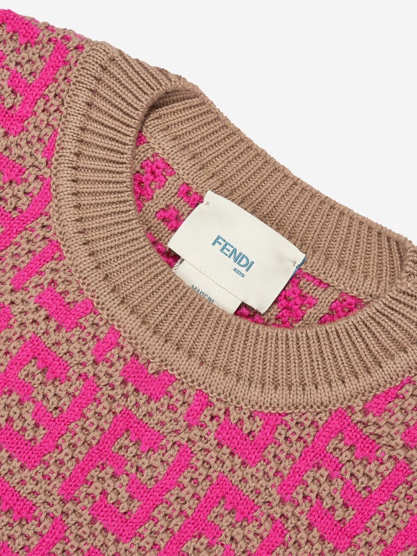 Fendi incorporate passion and energy into their meticulously crafted designs. Made in a beautiful wool and cotton combination, this girls knit top is depicted with the iconic FF monogram patterning all-over via ribbed trims and a straight hem. She will look and feel divine.  Made In Italy Cotton 50%  Wool 50%  Trim: 100% Cotton