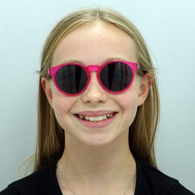 Smarty Round Kids Transparent Pink Black Grey X2944  Sunglasses Brighten your child's look with SMARTY Designer Sunglasses model X2944E, perfect for kids aged 3 to 7 years old. These round-shaped sunglasses feature a playful pink frame with durable plastic arms and grey lenses, providing superior UV protection and a fun, stylish appearance. The X2944E model combines trendy design with kid-friendly comfort and durability, making them ideal for any sunny day adventure. Available at an unbeatable discount from the regular retail price, these designer sunglasses offer exceptional quality and value. Give your child the perfect blend of style and protection with SMARTY sunglasses.
