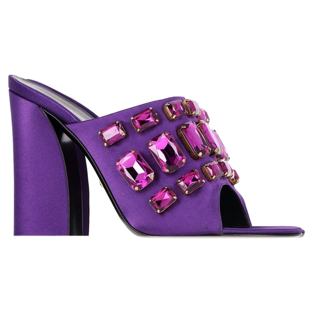VINTAGE, RRP AS NEW

A perfect blend of luxury, style, and comfort, these designer mules are made using quality materials and elegantly frame your feet. They are designed with round open toes, block heels, and crystals that make them look elegant. They can be paired with a host of outfits from your wardrobe.

with box.

Gucci Tessa Crystal Embellished Peep Toe Mules in Purple Satin 
Condition: Excellent
Signs of wear: Include Box., No visible sign of wear. No Mark at insole.,  Very light mark at soles.
Packaging: Box
Color: Violet | purple
Material: Satin | crepe-satin
Size: EU | 39.5 / US9.5
Measurements: Heel height: 110; Insole length: 270
SKU: NAPPUGBSH422710W