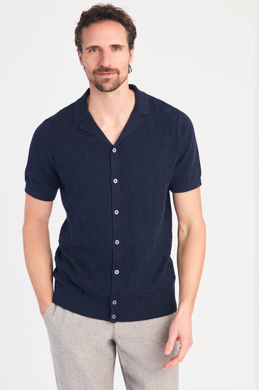 This knitted shirt from Kensington Eastside is a perfect mix of style and comfort. With a subtle checked pattern on the front and a laid-back Cuban collar, it’s an easy go-to for smart-casual outfits. Lightweight and breathable, it’s great for any occasion where you want to look sharp with minimal effort.