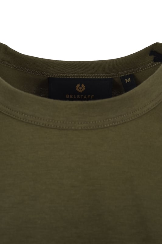 Belstaff Short Sleeved T-Shirt True Olive
This is the essential crew neck t-shirt from Belstaff. made from 100% cotton, featuring a crew neck, regular fit and the distinctive Belstaff badge to the chest. Ideal for wearing as is on a hot day or as a layer when things cool off.

100% Cotton
Crew Neck
Badge Logo to the chest
Style - 71140305