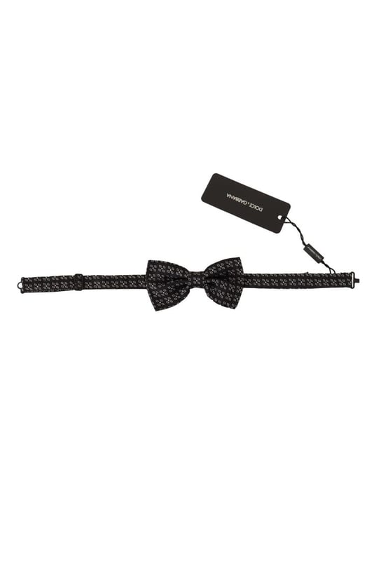 Stunning Dolce & Gabbana silk bow tie
  Black and white polka dot design
  Made from 100% silk
  Adjustable length neck strap
  Made in Italy
  Width: 6cm
Material: 100% Silk