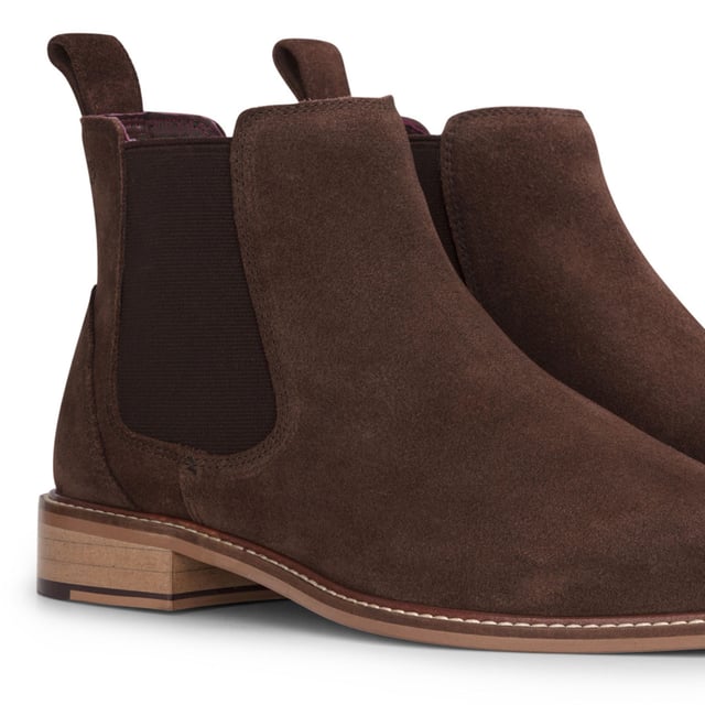 Elevate your footwear collection with the London Brogues Men's Brown Suede Leather Slip-On Chelsea Ankle Boots. Crafted from premium suede leather, these boots offer a luxurious look and feel, perfect for enhancing both casual and formal outfits. The convenient slip-on design features elastic side panels for a snug fit and easy wear. With a durable leather sole providing superior grip, these boots are suitable for various surfaces and weather conditions. Enjoy all-day comfort with the cushioned insole, making them ideal for long hours on your feet.

Premium Suede Leather for a sophisticated appearance
Slip-On Convenience with elastic side panels
Durable Sole with Superior Grip for traction
Cushioned Insole for Comfort ideal for extended wear