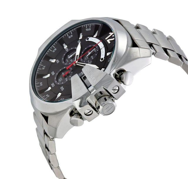 This Diesel Mega Chief Chronograph Watch for Men is the perfect timepiece to wear or to gift. It's Silver 51 mm Round case combined with the comfortable Silver Stainless steel watch band will ensure you enjoy this stunning timepiece without any compromise. Operated by a high quality Quartz movement and water resistant to 10 bars, your watch will keep ticking. This sporty and fashionable watch gives you a unique feeling in every outfit! -The watch has a calendar function: Date, Stop Watch, Luminous Hands, Luminous Numbers High quality 21 cm length and 26 mm width Silver Stainless steel strap with a Fold over with push button clasp Case diameter: 51 mm,case thickness: 14 mm, case colour: Silver and dial colour: Black