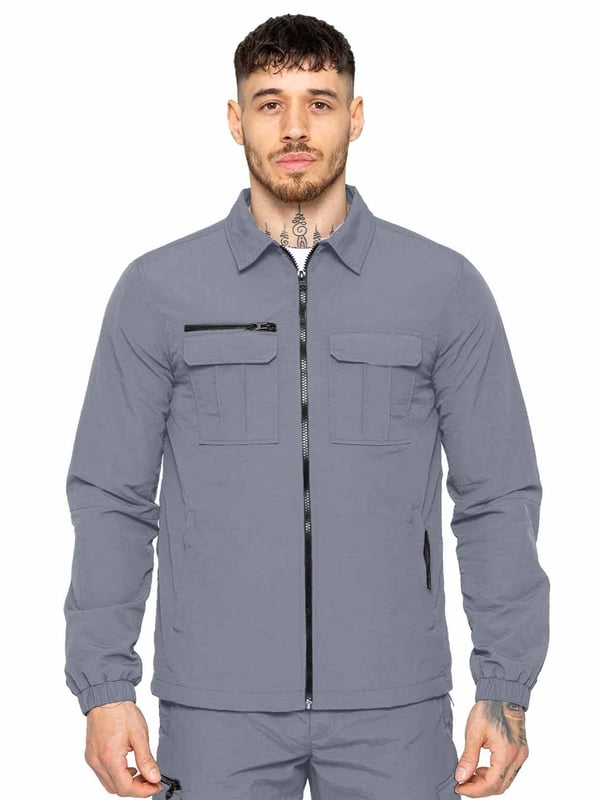 Expertly designed for outdoor activities and the transition to mid-season, this shirt jacket is constructed of crinkle nylon that is both water-repellent and wind-resistant. The fabric has a soft peach-fuzz feel and is complemented by a pointed collar, functional pockets, and a zip fastening to easily adjust the fit. The jacket is made with patch pockets and a flap on the chest, making it both functional and stylish.