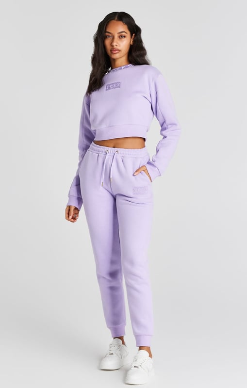 inchLilac Crop SweatshirtCropped fitSoft touchEmbroidered patchCrew neckPrinted neckbandMachine wash67% Cotton 33% Polyester inch