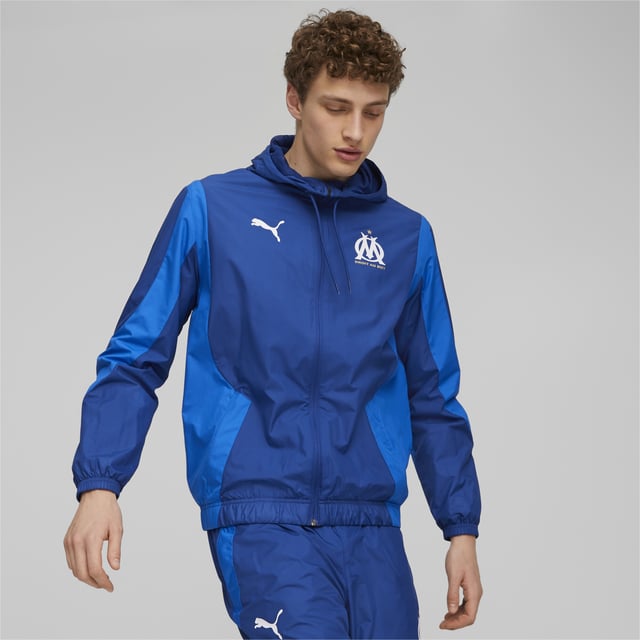 PRODUCT STORY: Allez l’OM! Enter Stade Vélodrome just like team Olympique de Marseille in this lightweight Pre-match jacket specially made to prepare for a dominating performance by Les Olympiens. FEATURES & BENEFITS: Recycled content: Made with 100% recycled material excluding trims and decorations as a step toward a better future. DETAILS: Regular fit; Standard jacket; Lined; Full-zip closure; Official team crest.