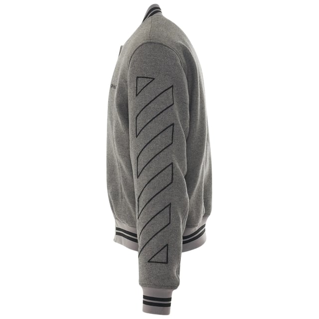 Off-White Diag Outline Grey Varsity Jacket. Elevate your style with the Off-White Grey Varisty Jacket. This Italian-made jacket features a sleek drag outline design, perfect for those who appreciate attention to detail. Show off your fashion expertise and stay on trend with this must-have statement piece.. Pop Button Closure, Brand logo On Chest, Made In Italy, Off-White Grey Jacket. 2 Open Front Pockets, Diag Design On Arms. 38% Cotton, 32% Wool, 14% Acrylic, 11% Polyamide, 5% Alter Fibre. Style Code: OMEA315C99FAB0010810