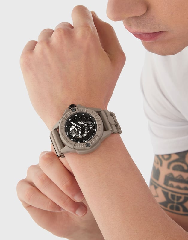 This Philipp Plein The $kull Ecoceramic Analogue Watch for Men is the perfect timepiece to wear or to gift. It's Taupe 44 mm Round case combined with the comfortable Taupe Silicone watch band will ensure you enjoy this stunning timepiece without any compromise. Operated by a high quality Quartz movement and water resistant to 5 bars, your watch will keep ticking.