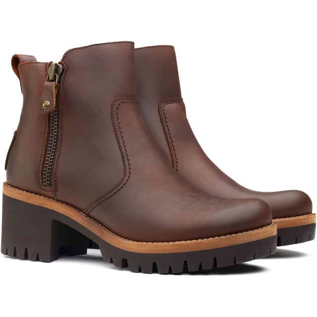 Step Out In Style And Confidence With The Panama Jack Pauline Ankle Boots. These Black Leather Boots Blend Premium Materials With The Durability Of A Sturdy, Cleated Rubber Sole For Grip, Whilst The Block Heel Provides Extra Height. Their Contemporary Design Showcases A Toggled Zip With Silver Hardware, Heel Branding And Contrasting Sole Detailing. They're As Stylish As Comfortable To Wear. Whether Navigating City Streets Or Exploring Country Fairs, These Panama Jack Boots Are Your Quintessential Companion For A Versatile, Chic Look.